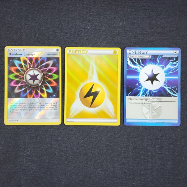 Three Assorted Vintage Pokemon Trading Cards Including Holo's!