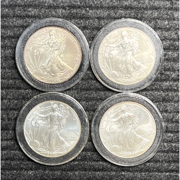 Lot of 4 American silver Eagles.  Years 1998, 1999, 2000, and 2001.
