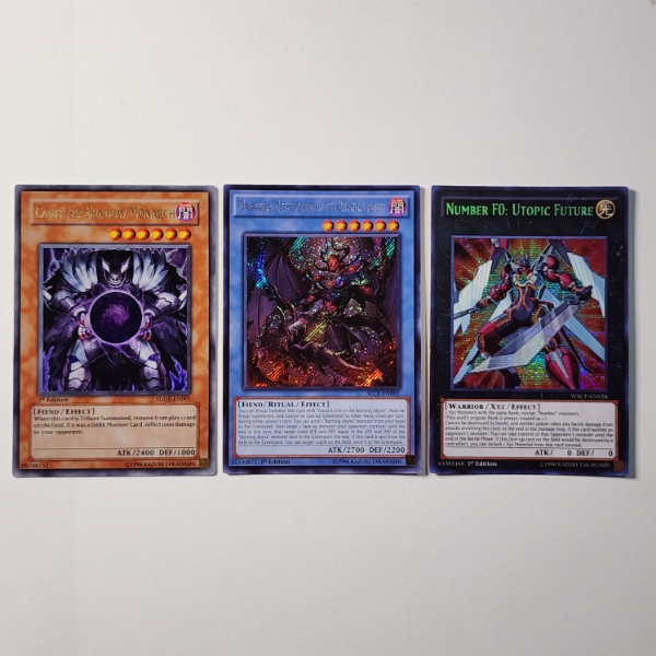 Three Assorted Holo RARE Yu-Gi-Oh Trading Cards Ft. 1ST EDITION Monarch!