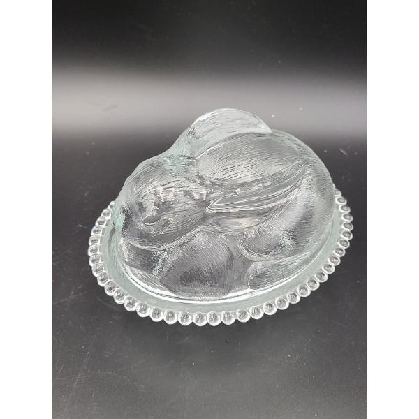 Indiana Glass clear bunny rabbit on a nest candy dish featuring a textured, two-piece pressed glass 