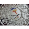 Image 6 : BREATHTAKING Sydney 2000 Olympics Masterpiece KILO SILVER ROUND in Protective Case & Wooden Display