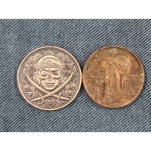 Two 1 Oz Copper Rounds - One Featuring Liberty & One Featuring A Pirate Skull & Ship