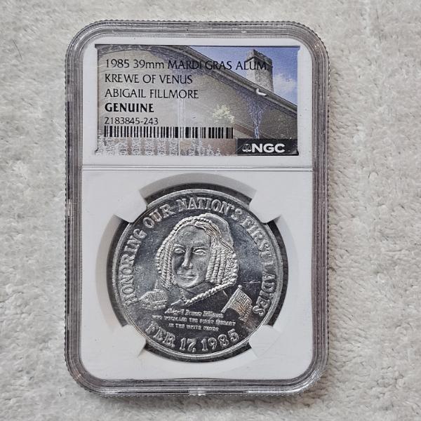 NGC Genuine 1985 39mm Mardi Gras Alum Krewe Of Venus Abigail Fillmore Doubloon Token