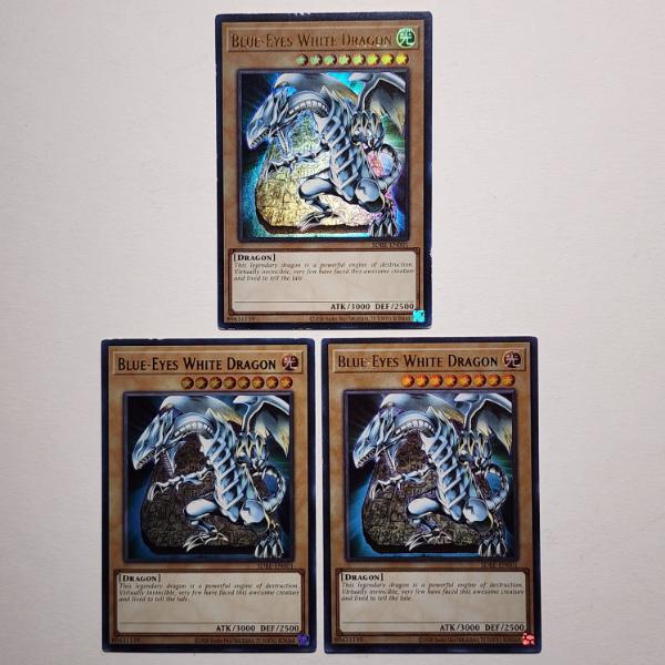 Three Assorted Holo Rare Blue Eyes White Dragon Yu-Gi-Oh Trading Cards