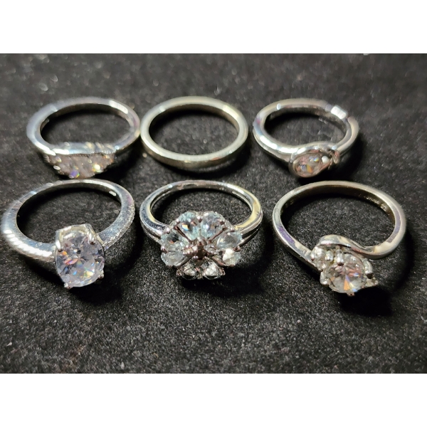 Six Sterling Silver Rings Ft. Clear Stones & One Without Stones - Total Weight: 14.6 Grams