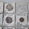 Image 8 : Two Binder Pages Filled with Assorted World Coins: Cuba, Argentina, Australia, India, & More!