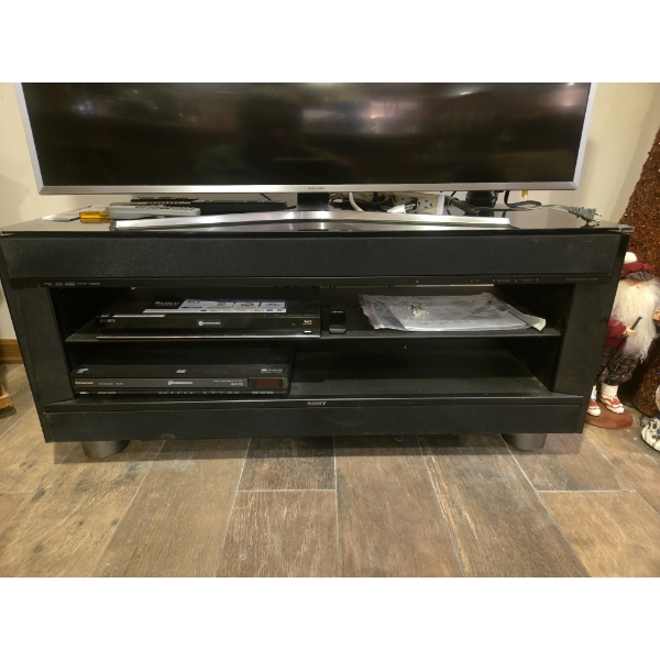 Samsung TV With Remote, Sony TV Stand W Built In Speakers, Sony Blu Ray Player, And Panasonic 5 Disc