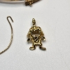 Image 2 : 10K Yellow Gold Jewelry: Bangle, Tasmanian Devil Pendant, Loop Piece - Total Weight: 5.1g