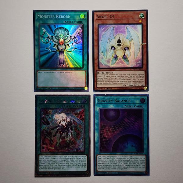 Four Assorted Holo Yu-Gi-Oh Trading Cards 