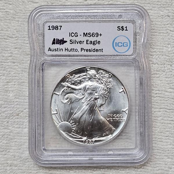 Austin Hutto Signed 1987 American 99.9% Silver Eagle Coin Graded as MS69+ by the ICG
