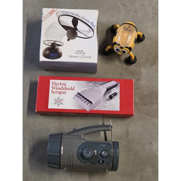 Electronics Group Including Flying Alarm Clock, Radio Flashlight Combo, Heated Window Scraper & Bee 
