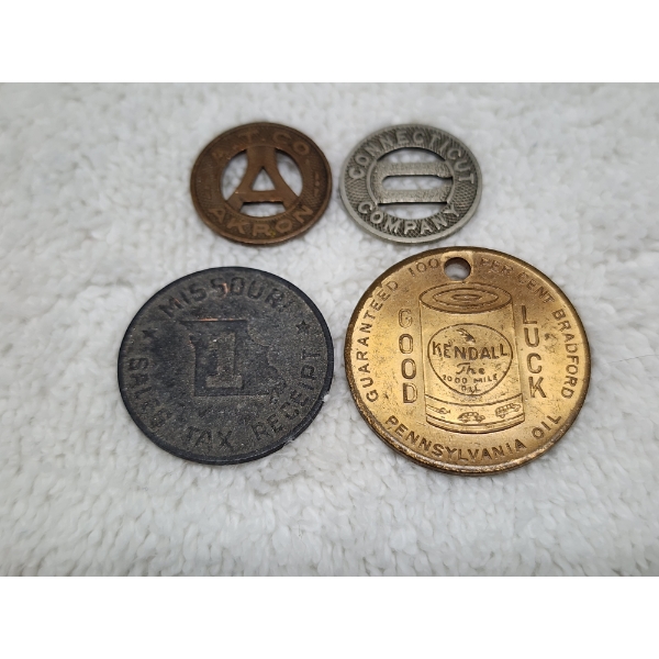 Four Assorted US Tokens Ft. Two Fare Tokens, 1 Tax Token & A World's Fair Kendall Oil Coin