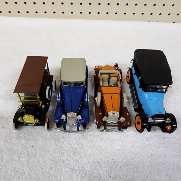 Four Assorted Collectible Die Cast Scale Replica Collectible Cars