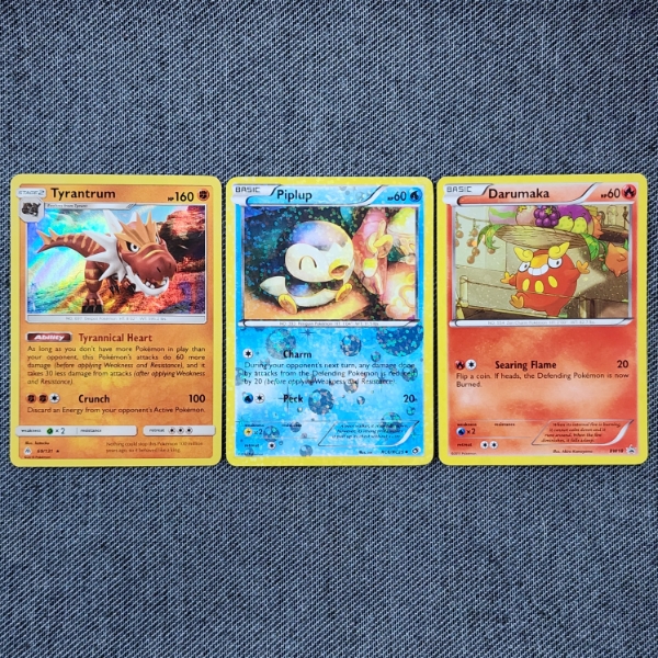 Lot of Three Assorted Holo & Reverse Holo Pokemon Trading Cards Including Black Star Promo & Radiant