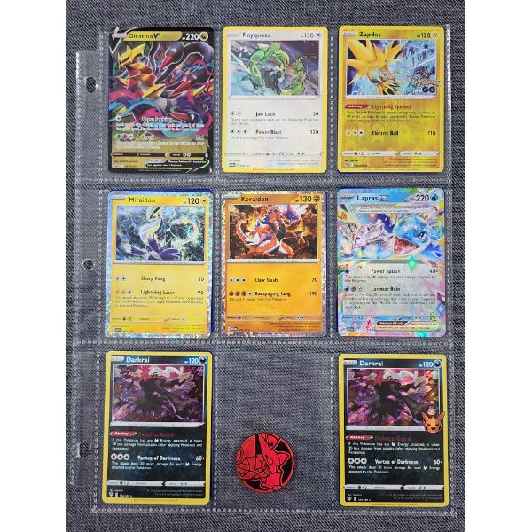 Binder Page Full of Assorted Pokemon Trading Cards Including Rares, Holos & More!