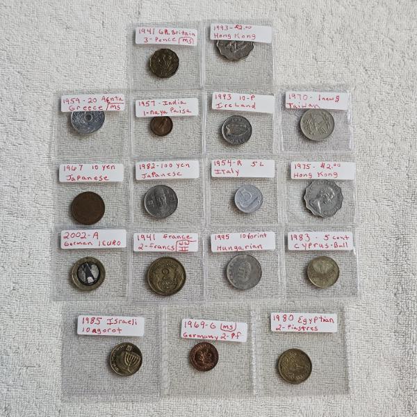 17 Various World Coins Housed in Individual Plastic Sleeves