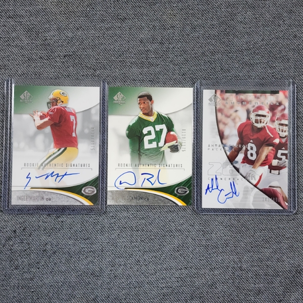 Three Assorted Autographed & Numbered Green Bay Packers Rookie Authentic Upper Deck Football Cards