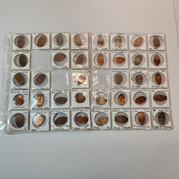 Two Binder Pages of Assorted Pressed Pennies From Various Landmarks