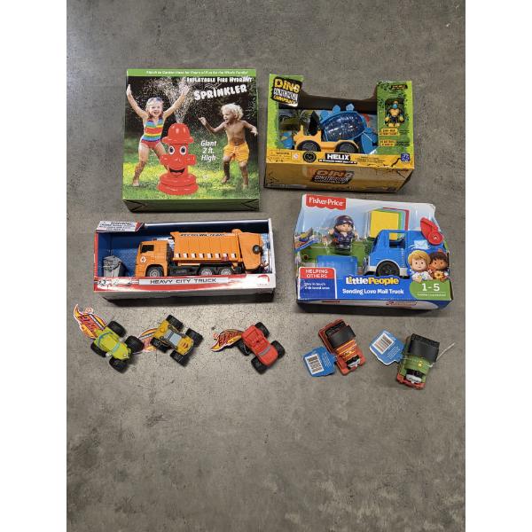 Brand New Toy Group Including Blow Up Sprinkler And Assorted Trucks