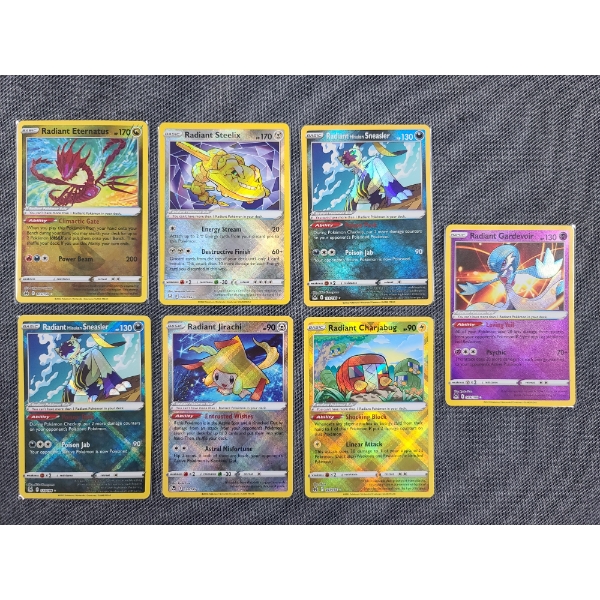 Lot of 7 Assorted 2022 Holo Radiant Pokemon Trading Cards Including Jirachi, Steelix & More!