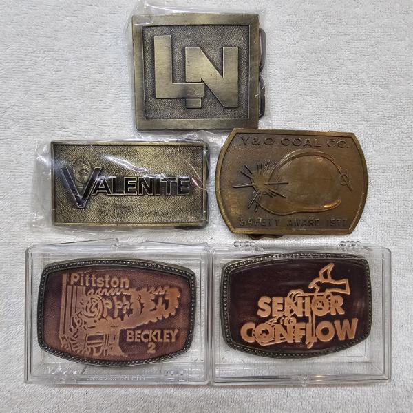 Five Vintage Industrial and Corporate Advertising Brass and Tooled Leather Belt Buckles