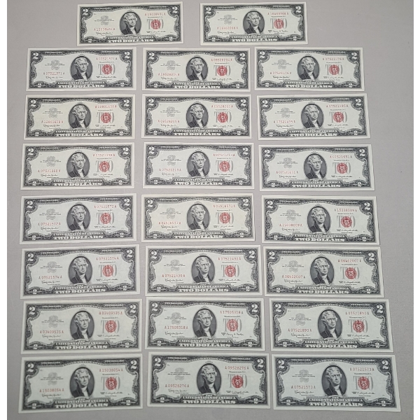 (23) United States Series 1963 $2 Red Seal Bank Notes - AU 58 Condition 