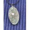 Image 3 : Oval Green Crystal Pendant with Striking Gold Om Symbol centered within radiant sunburst design 