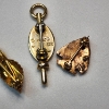 Image 3 : Three 10K Gold Pins: Rose Design, Greek, and Shield Bage - Total Weight: 5.0g