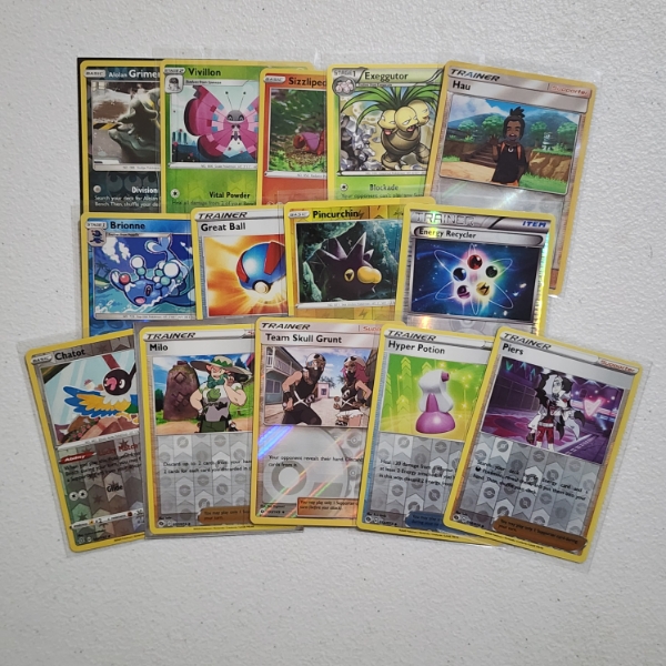 Fourteen Assorted Pokemon Trading Cards Including Rare & Reverse Holo's!