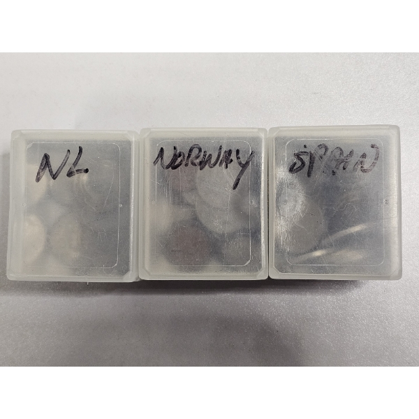 Assortment of International Coins in Plastic Cases