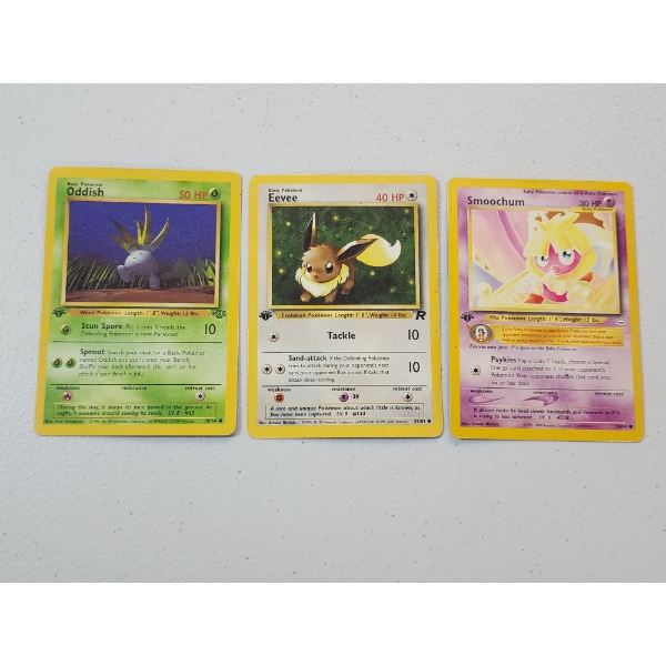 Three 1st Edition Vintage Pokemon Cards: Oddish 58/64, Eevee 55/82, & Smoochum 54/64