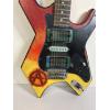 Image 2 : Modified B.C. Rich Warlock electric guitar with a custom painted red, yellow, and black finish 