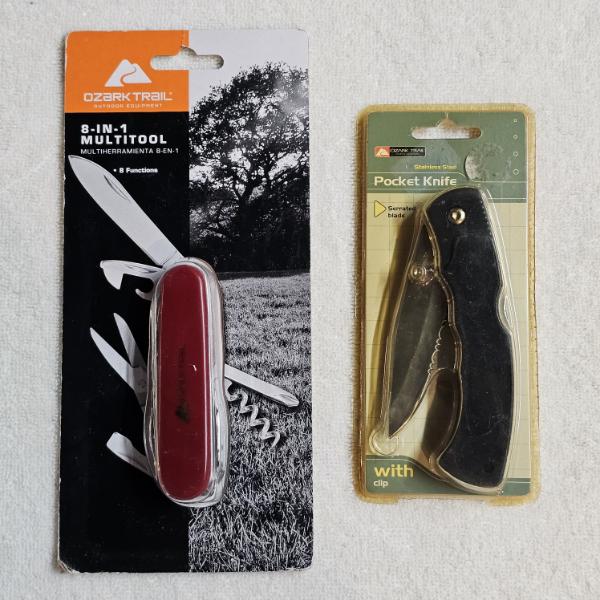 Two Ozark Trail Branded Outdoor Tools: An 8-in-1 Multi-Tool in Red and a Black Folding Pocket Knife