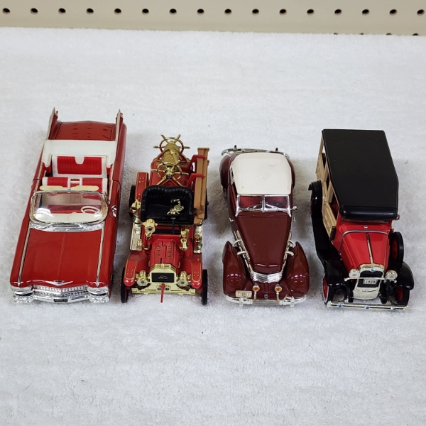 Four Assorted Collectible Die Cast Scale Replica Collectible Cars