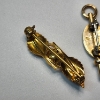Image 4 : Three 10K Gold Pins: Rose Design, Greek, and Shield Bage - Total Weight: 5.0g