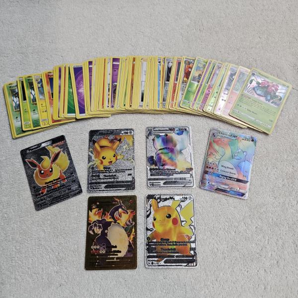 Assortment of Pokemon Trading Cards including Holos and Reproductions