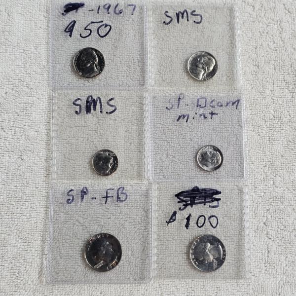 An Assortment of Six United States Coins including SMS and SP DCAM FV: $.80
