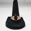 Image 1 : Beautiful 10K Gold Ring with Deep Red Center Stone - Size 10 - TW: 5.3g