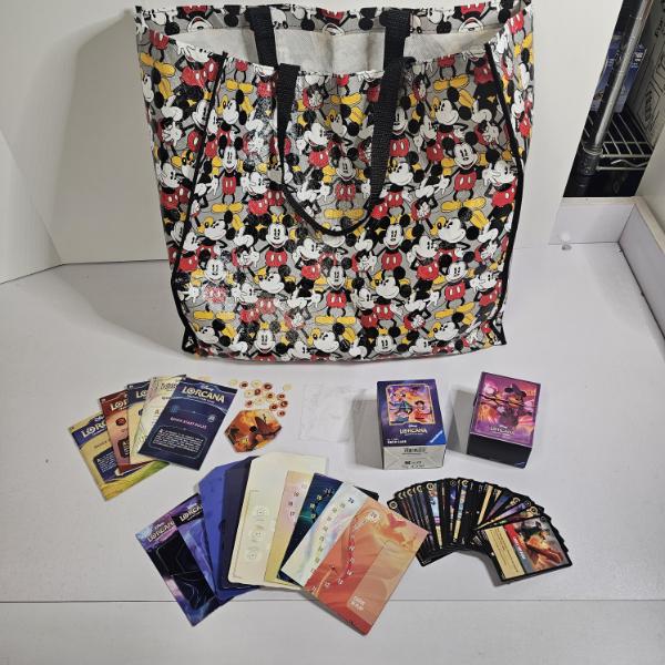 Disney Lorcana Lot With Deck Case, Sleeves, Cards, Token Trackers, Rulebooks, And Tote Bag