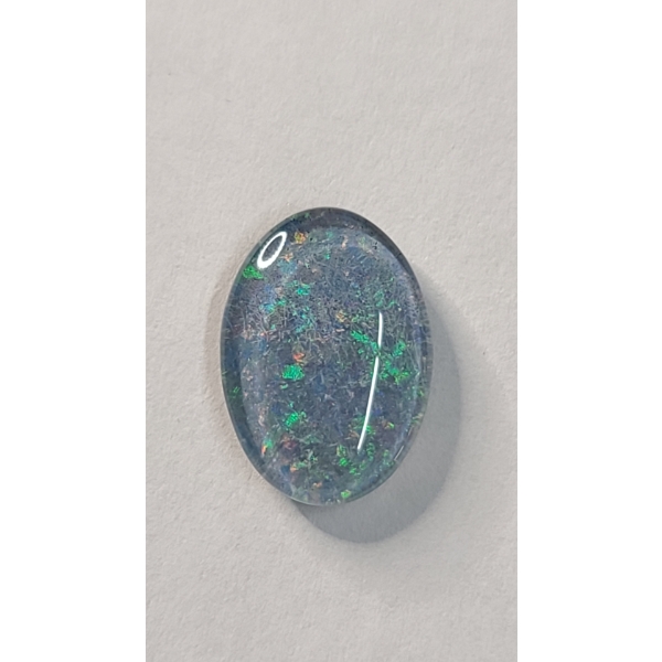 Polished Cabochon Cut Large Opal With Dark Composite Backing