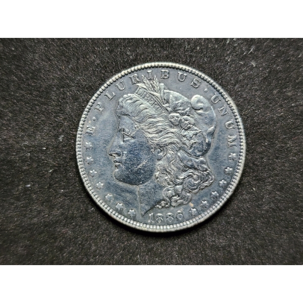1886 Morgan Silver Dollar With Unique Darker Toning On One Side!