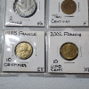 Image 6 : Two Binder Pages Filled with Assorted World Coins: Switzerland, France, Sweden, Italy, & More!