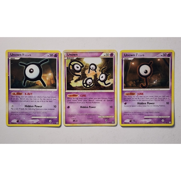 Three Vintage Pokemon Trading Cards Featuring Unown