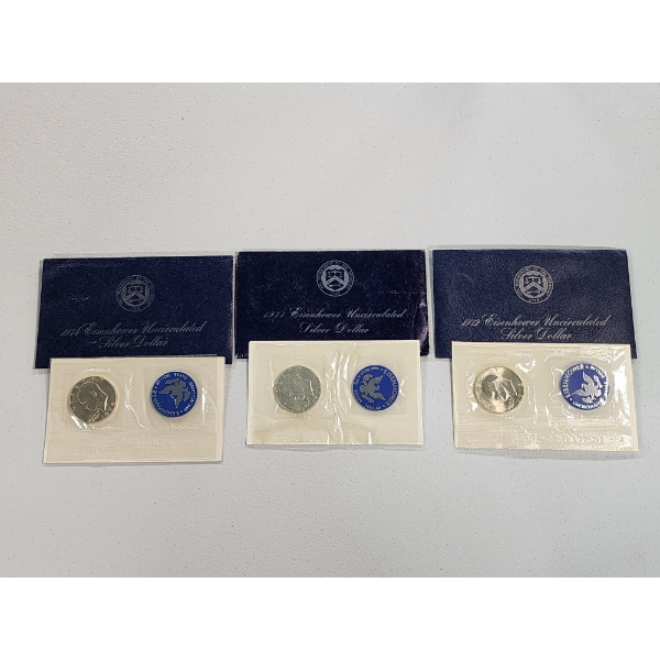 (3) Uncirculated Eisenhower "Blue Pack" Silver Dollars Years: 1974, 1971, 1972