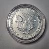 Image 2 : Stunning 1991 American Silver Eagle - 1 oz .999 Fine Silver $1 Coin in Capsule