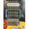 Image 7 : Modified B.C. Rich Warlock electric guitar with a custom painted red, yellow, and black finish 