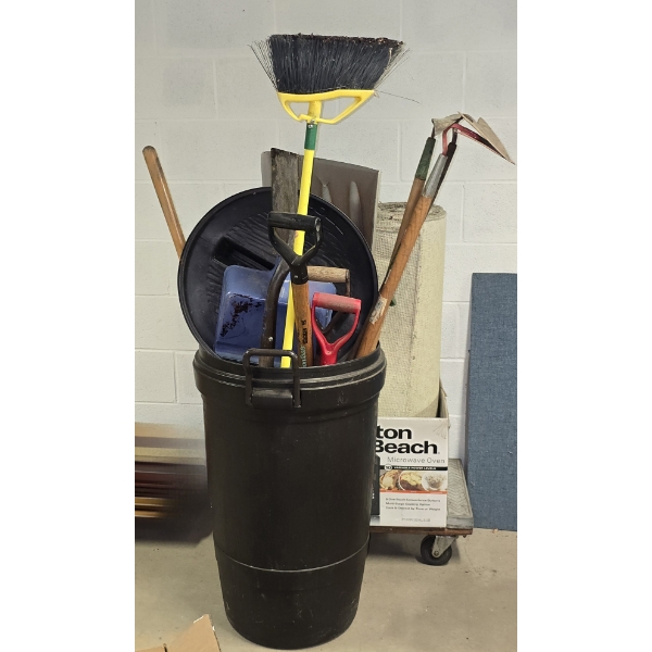 Rolling Trash Can with Lid Filled with Garden Tools