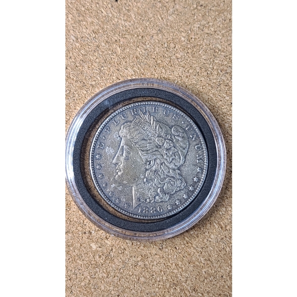 1886 90% Silver Morgan Dollar In Coin Capsule