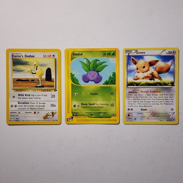 Three Vintage Pokemon Trading Cards Including Blaine's Doduo, Eevee & E-Reader Oddish
