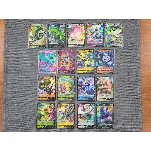 Lot of 17 Assorted Foreign Pokemon Trading Cards Ft. TyranitarV & CelebiVMAX